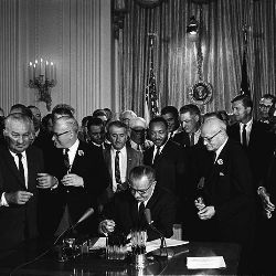 President Lyndon B. Johnson signing the 1964 Civil Rights Act